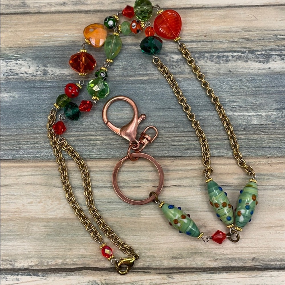 Adorned Crown assemblage orange green bead lanyard keychain badge