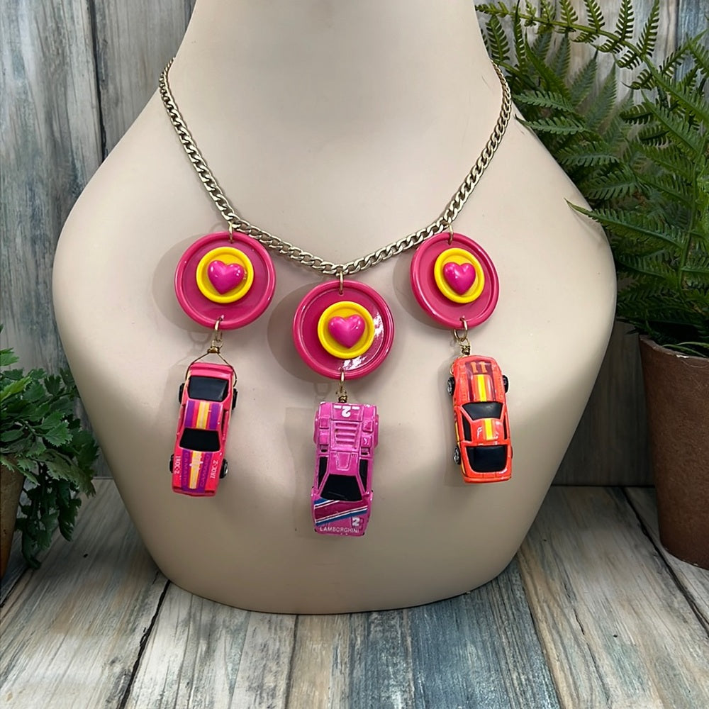 Adorned Crown artisan assemblage child’s play pink car necklace