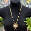 Adorned Crown Jewelry filigree oval link rhinestone pendant necklace