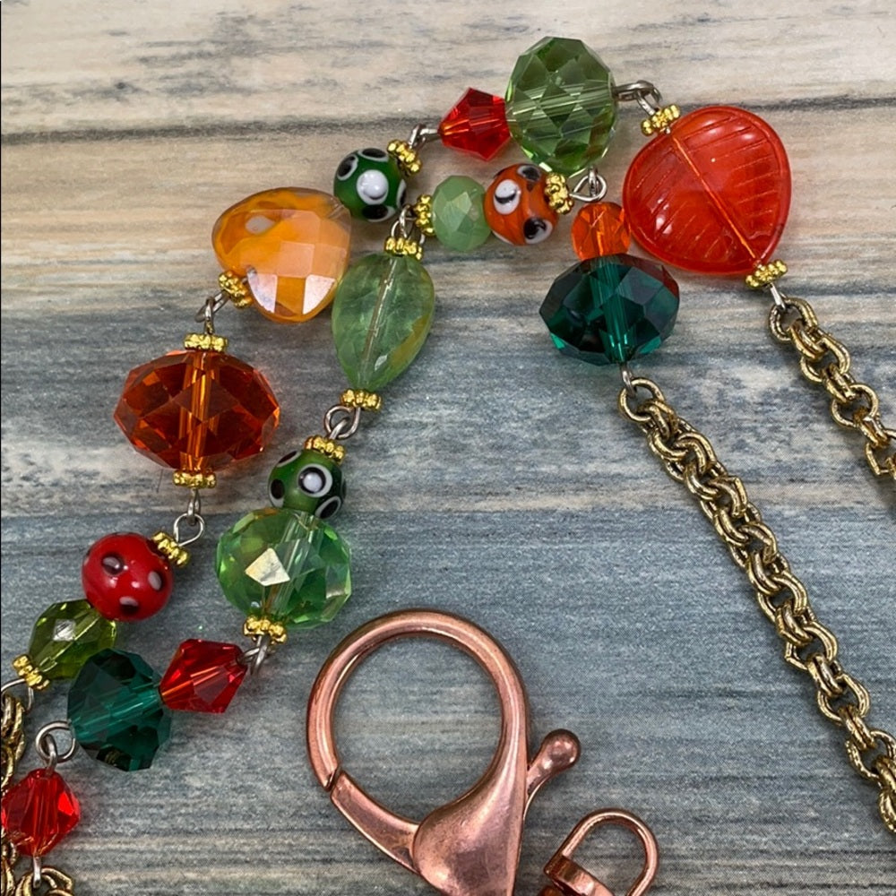 Adorned Crown assemblage orange green bead lanyard keychain badge