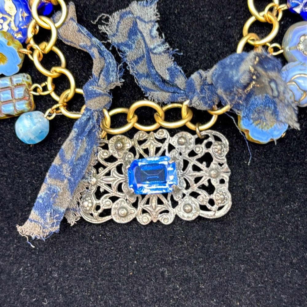 Adorned Crown Jewelry assemblage filigree shades of blue blue charm bracelet