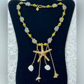 Adorned Crown Assemblage beaches & butterflies starfish fossil bead necklace