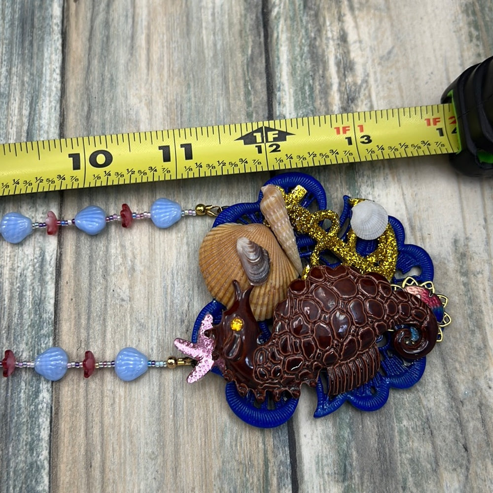 Adorned Crown Assemblage beaches & butterflies seahorse collage necklace