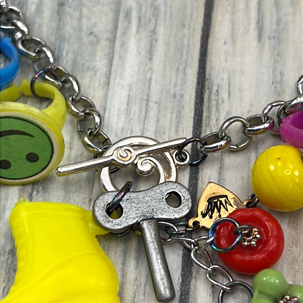 Adorned Crown artisan assemblage child’s roller skate happy face necklace
