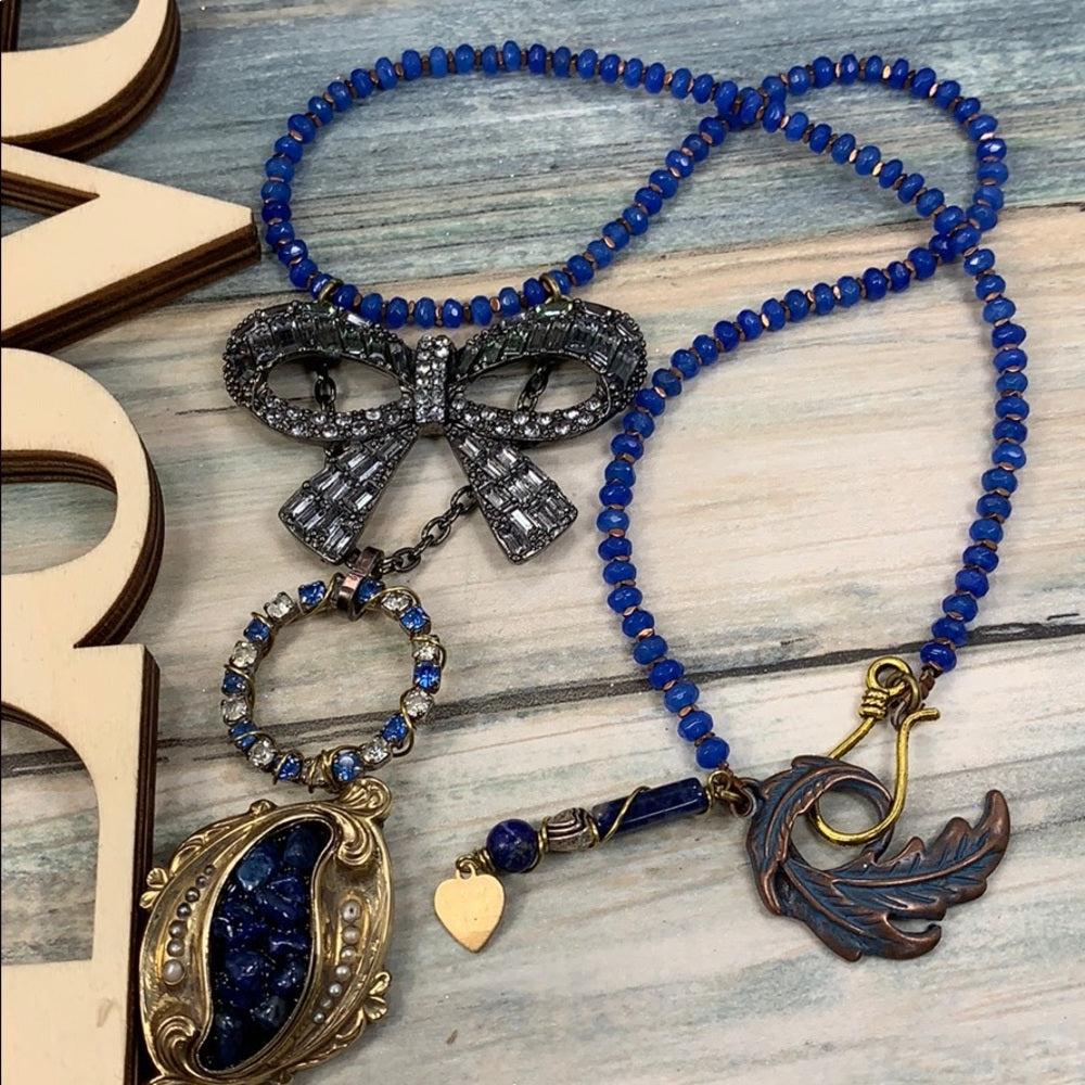 Adorned Crown artisan assemblage gold lapis rhinestone bow necklace