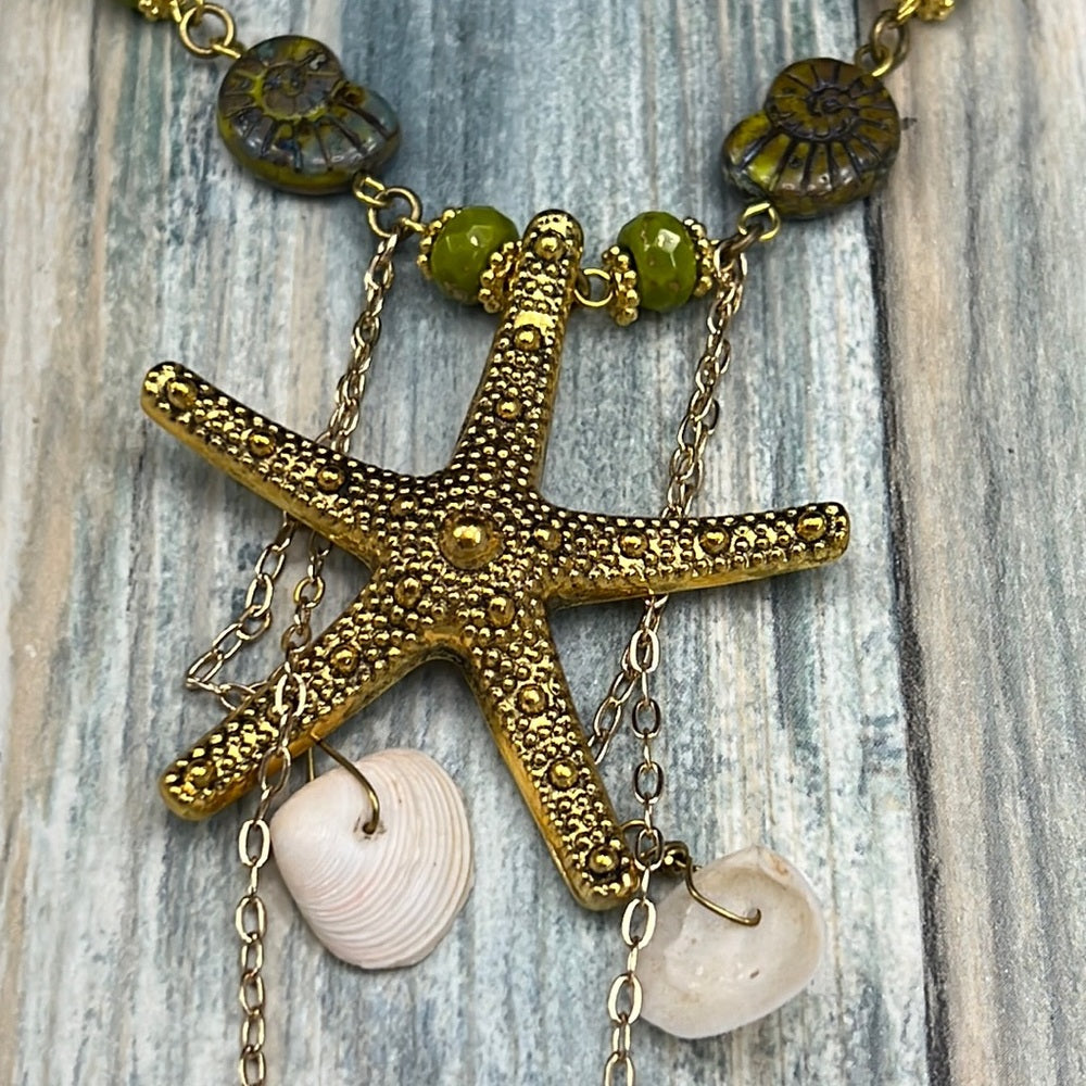 Adorned Crown Assemblage beaches & butterflies starfish fossil bead necklace