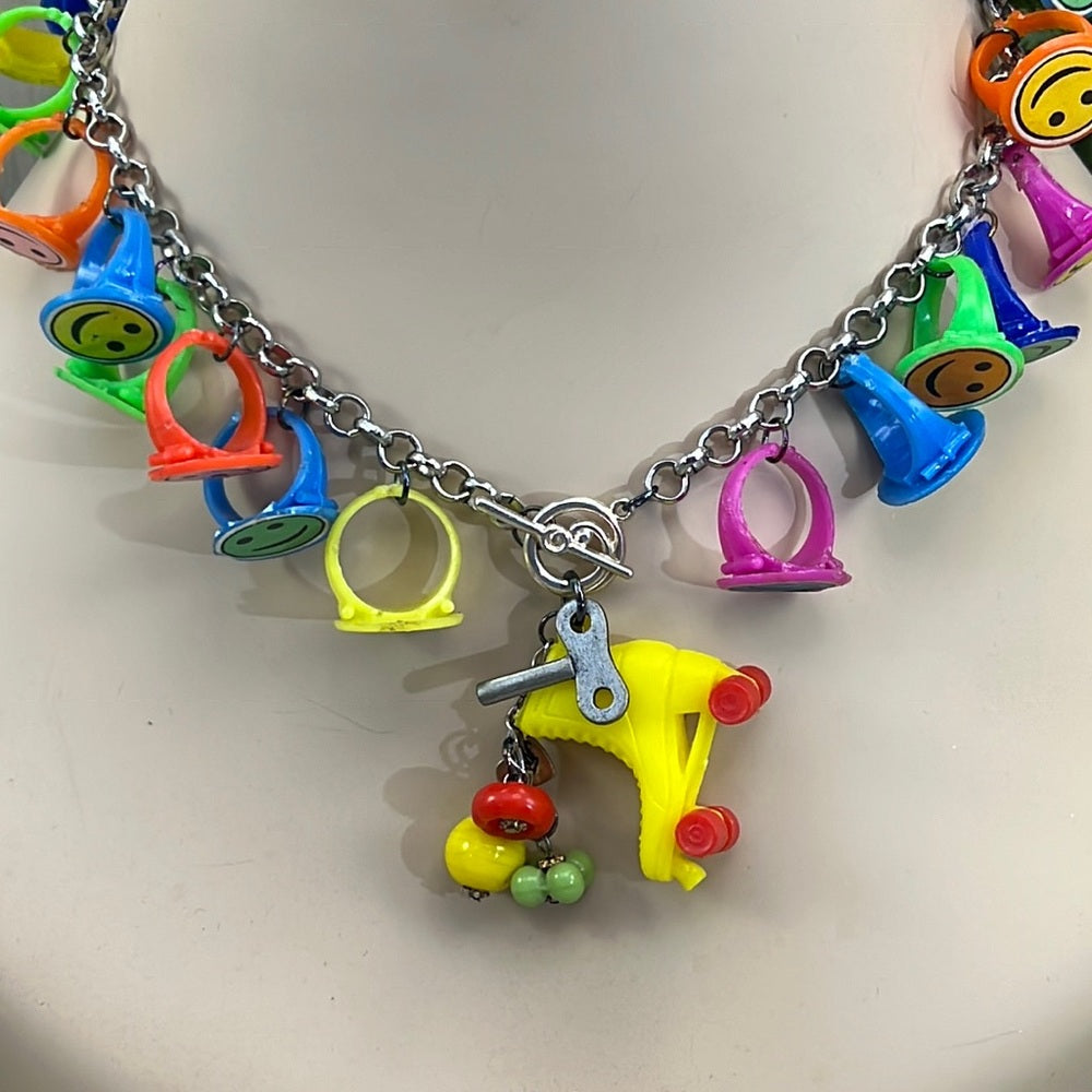 Adorned Crown artisan assemblage child’s roller skate happy face necklace