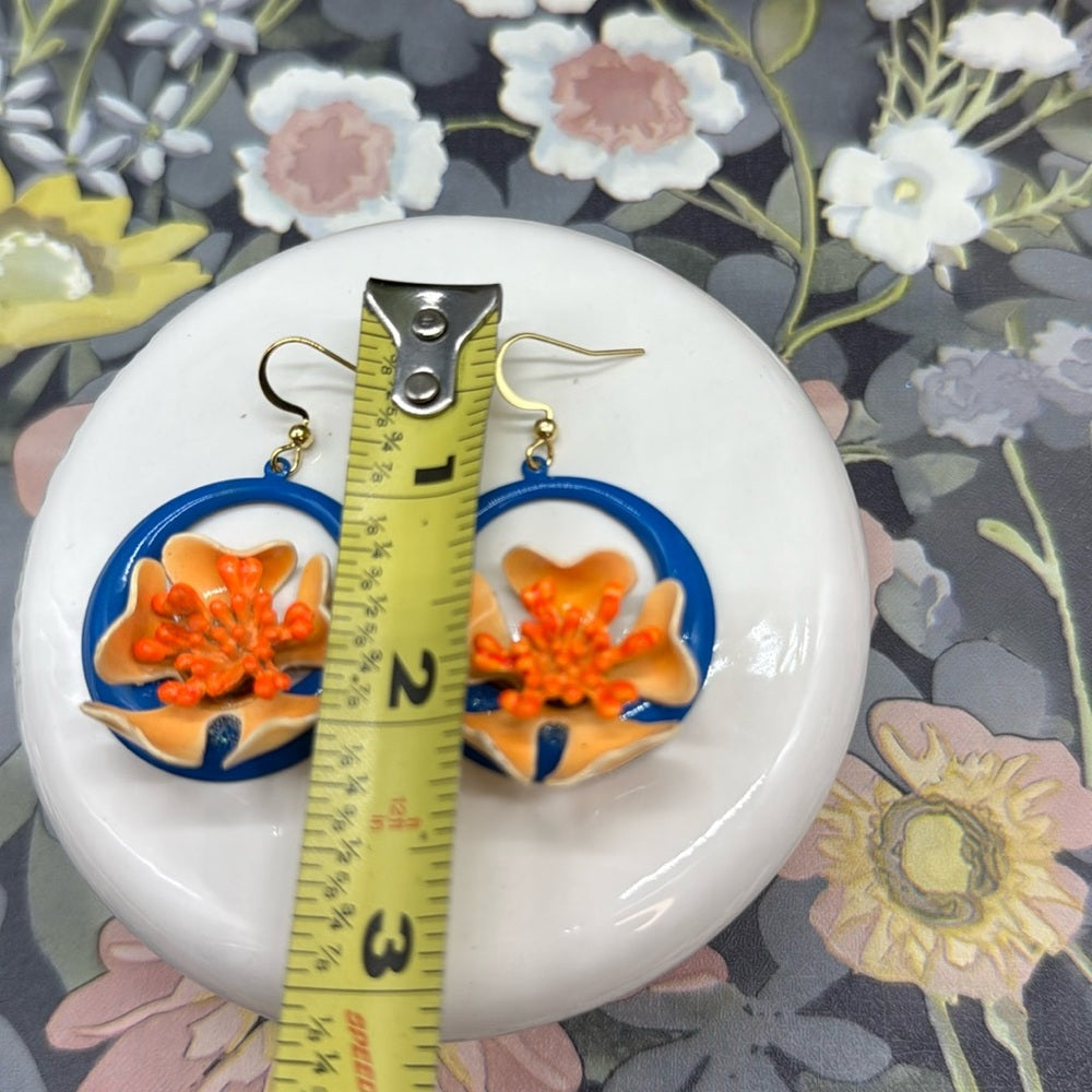 Adorned Crown orange enamel flower on neon teal circle drop earrings