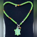 Adorned Crown Assemblage beaches & butterflies turtle anchor necklace