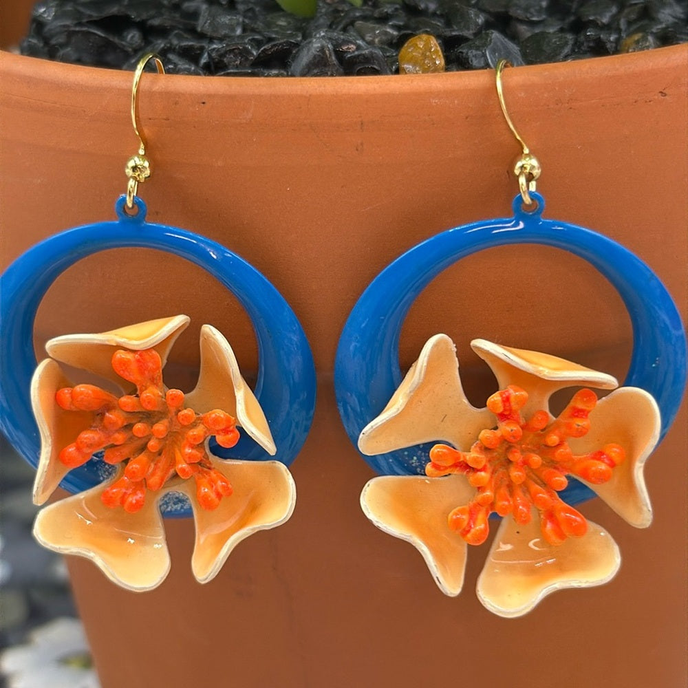 Adorned Crown orange enamel flower on neon teal circle drop earrings