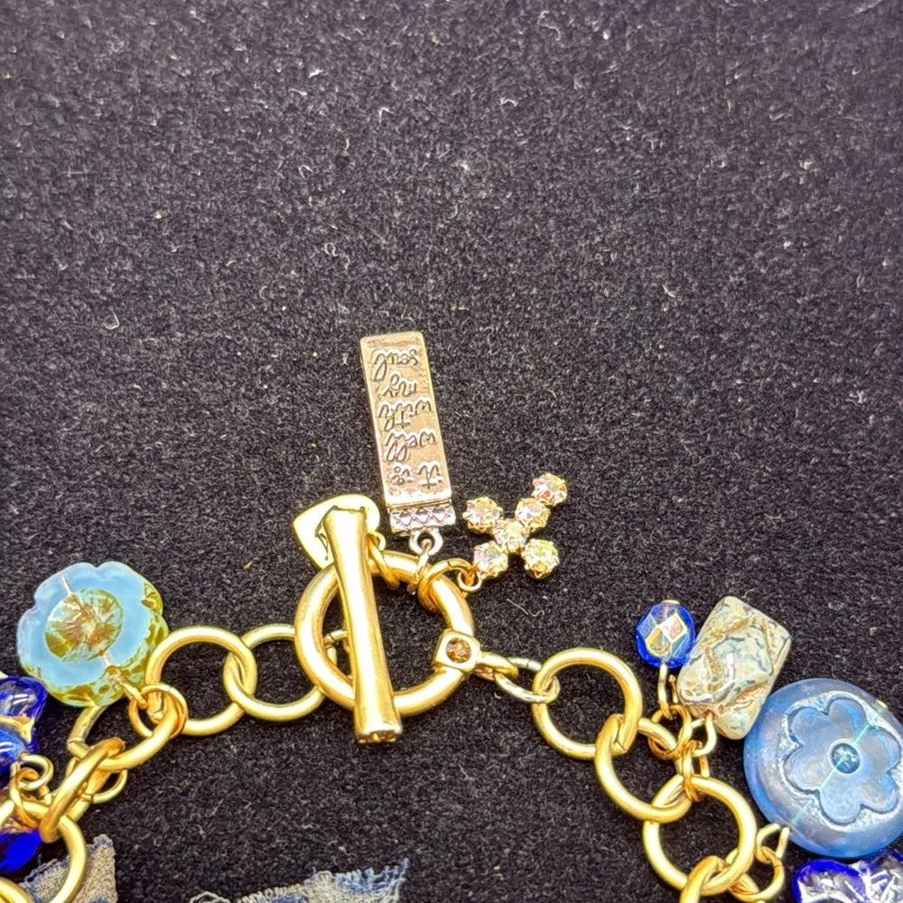 Adorned Crown Jewelry assemblage filigree shades of blue blue charm bracelet