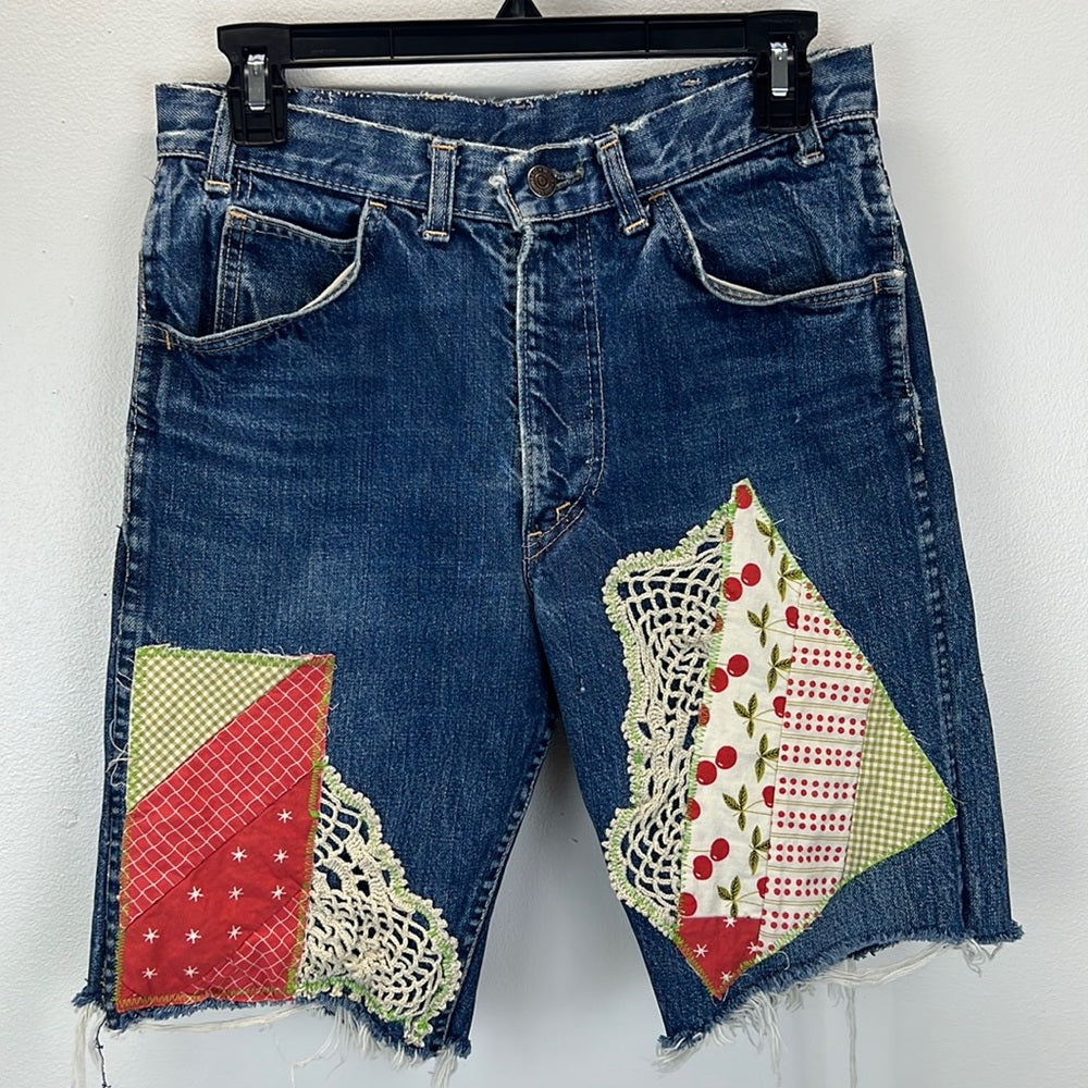 Adorned Crown Textile reworked patch Big E Levi’s cut off shorts upcycle