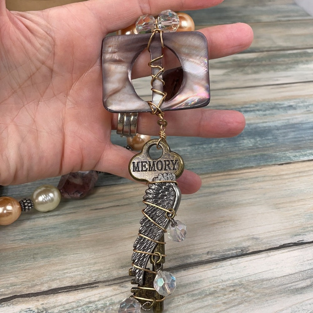 Adorned Crown Artisan assemblage shell buckle skeleton key necklace