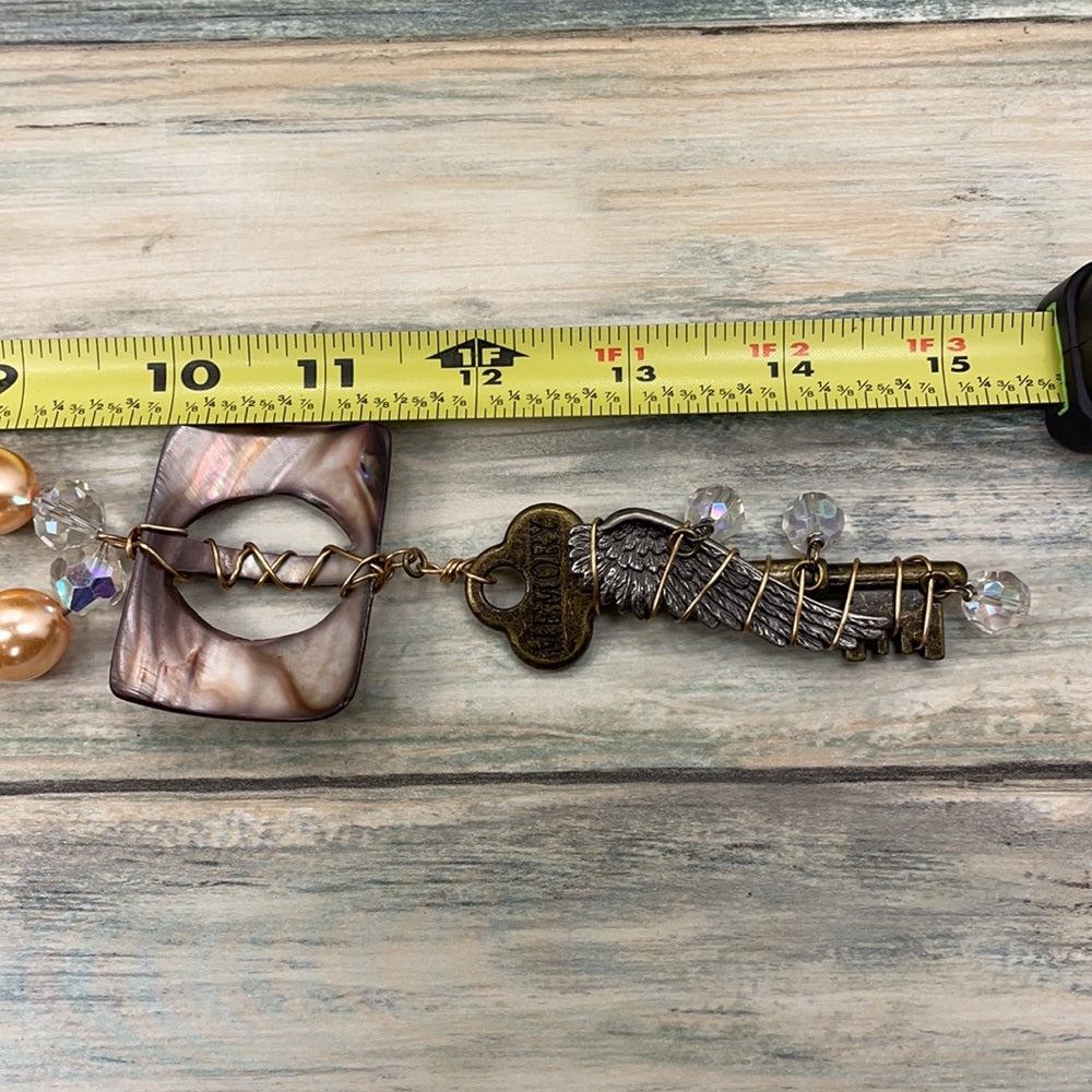 Adorned Crown Artisan assemblage shell buckle skeleton key necklace