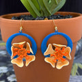 Adorned Crown orange enamel flower on neon teal circle drop earrings