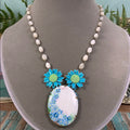 Adorned Crown artisan assemblage blue painted flower rosary bead necklace