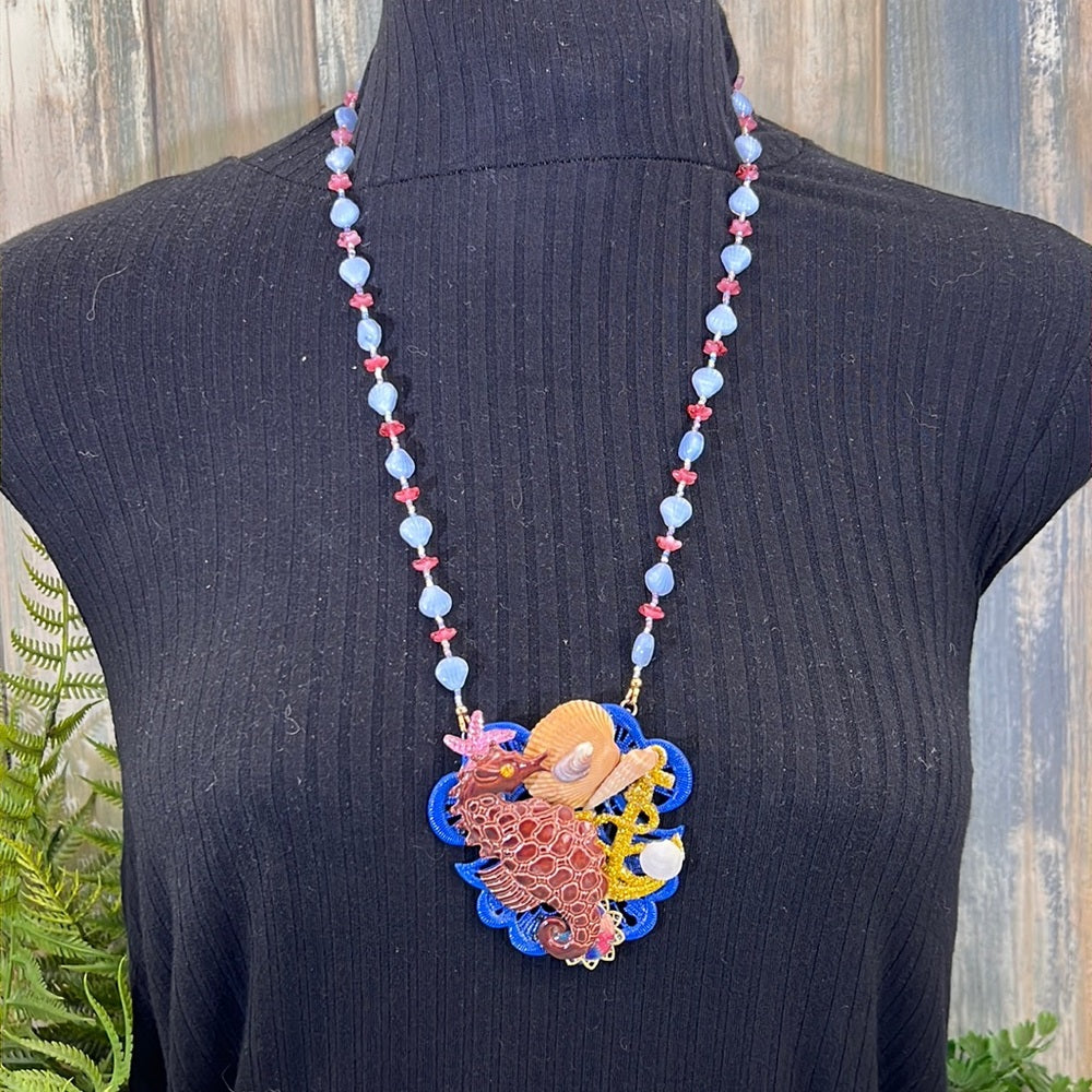Adorned Crown Assemblage beaches & butterflies seahorse collage necklace