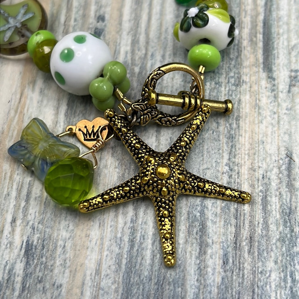 Adorned Crown Assemblage beaches & butterflies green starfish bracelet