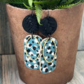 Adorned Crown Artisan Assemblage dotted leather faux leather oval earrings
