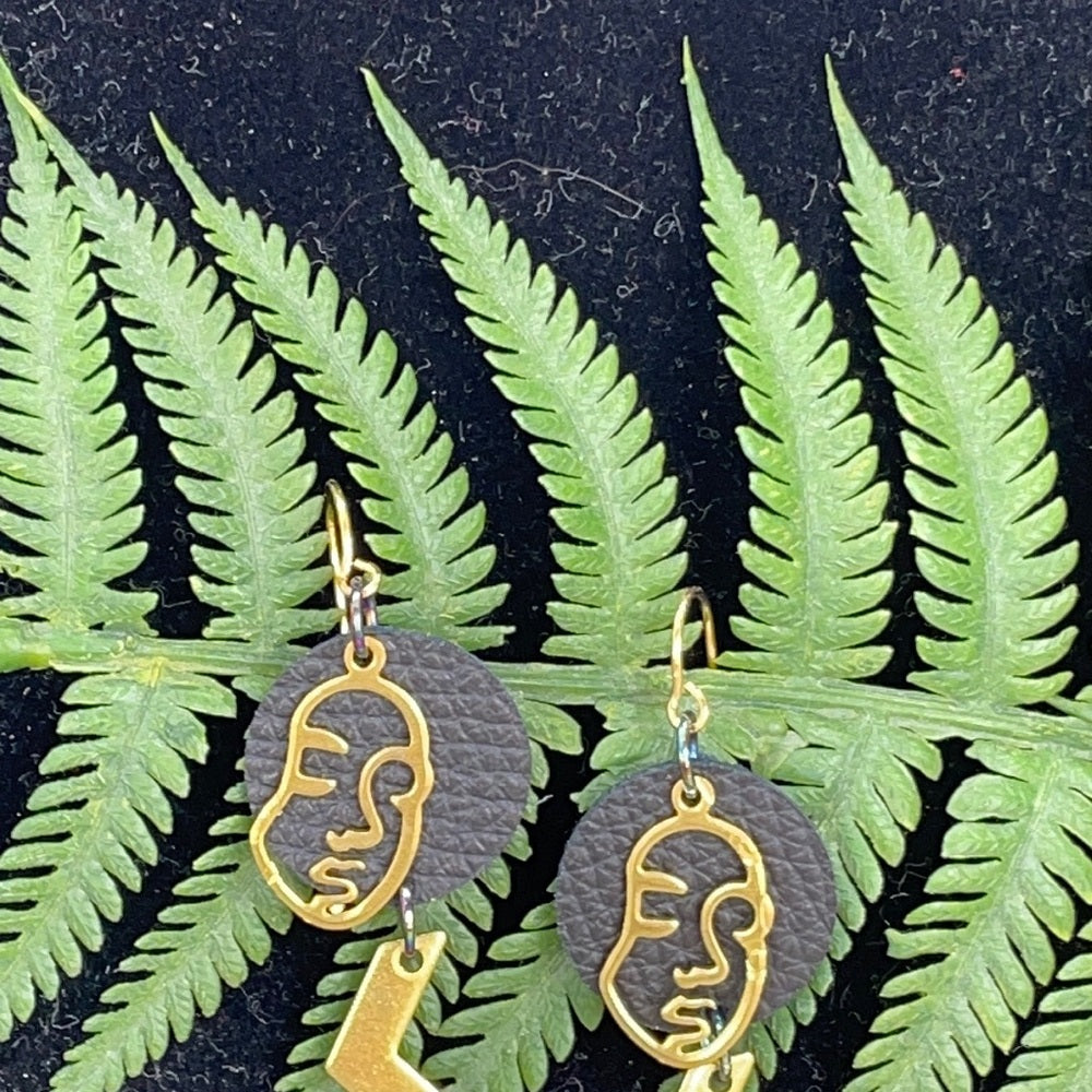 Adorned Crown geometric face zig zag leather earrings