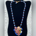 Adorned Crown Assemblage beaches & butterflies seahorse collage necklace