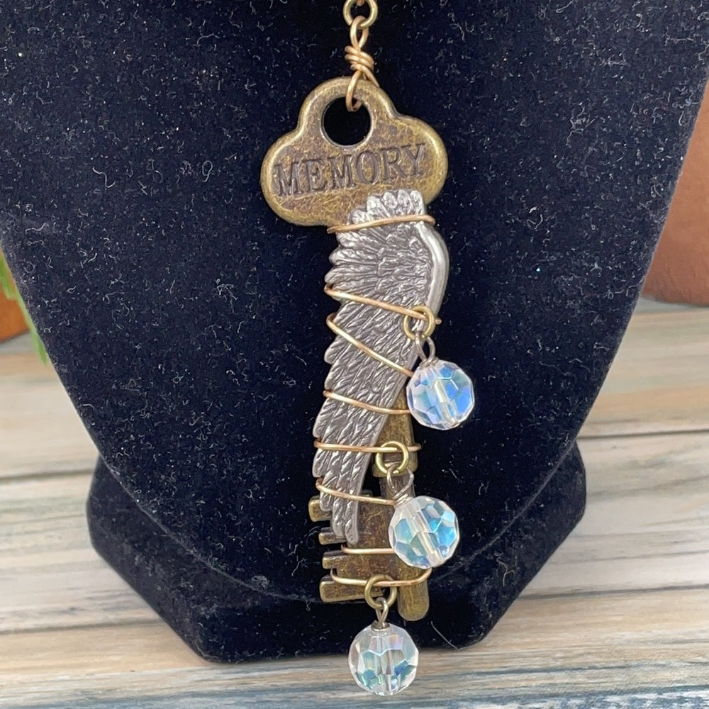 Adorned Crown Artisan assemblage shell buckle skeleton key necklace
