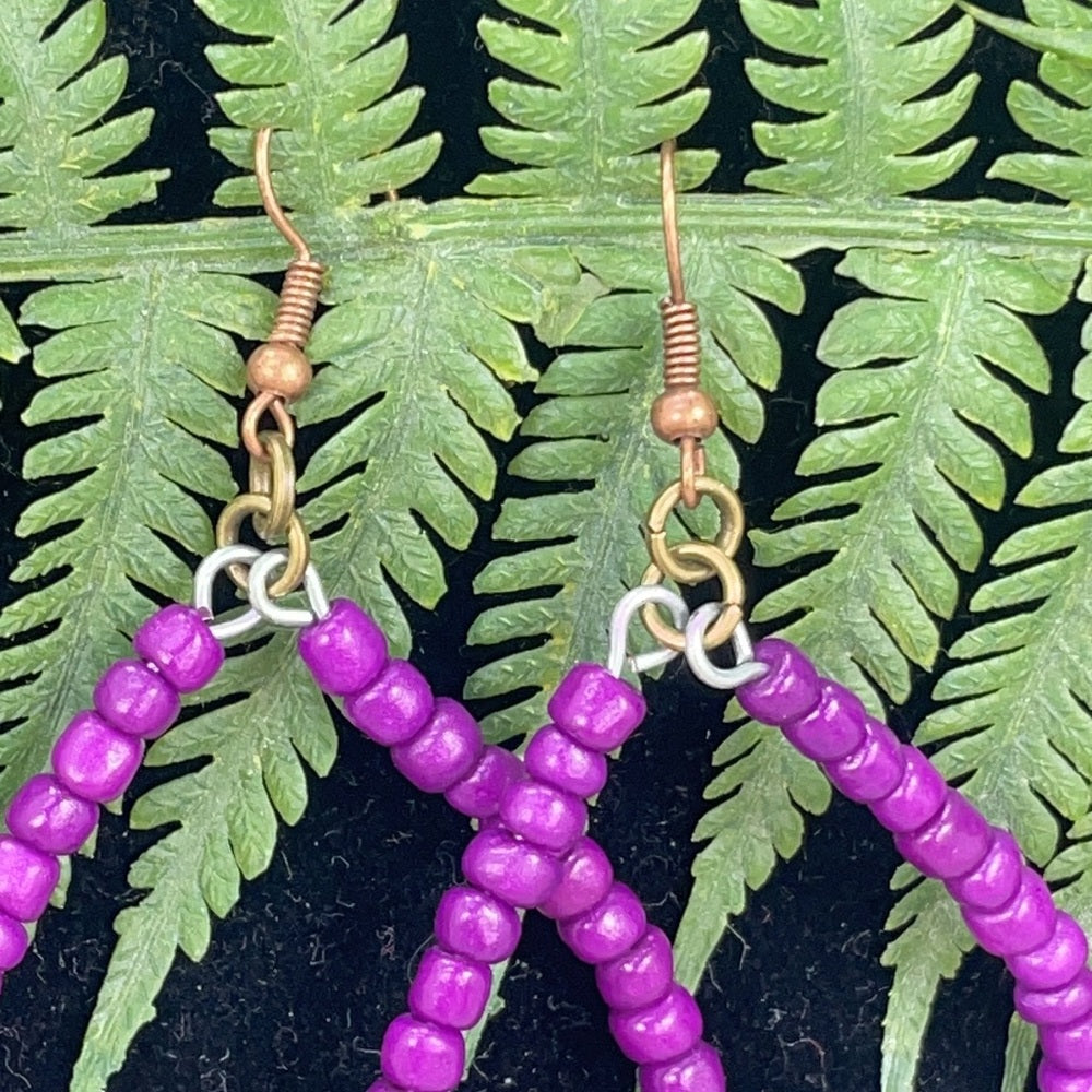 Adorned Crown assemblage pop of color purple hoop earrings