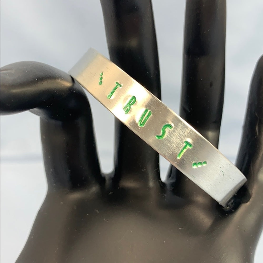 Adorned Crown Trust green stamp cuff bracelet