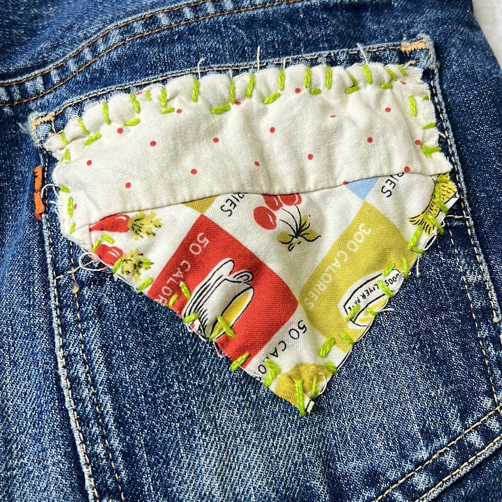 Adorned Crown Textile reworked patch Big E Levi’s cut off shorts upcycle