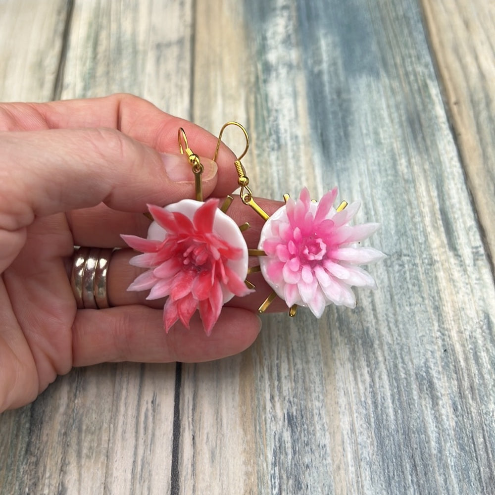 Adorned Crown Assemblage child’s play flower saucer starburst earrings