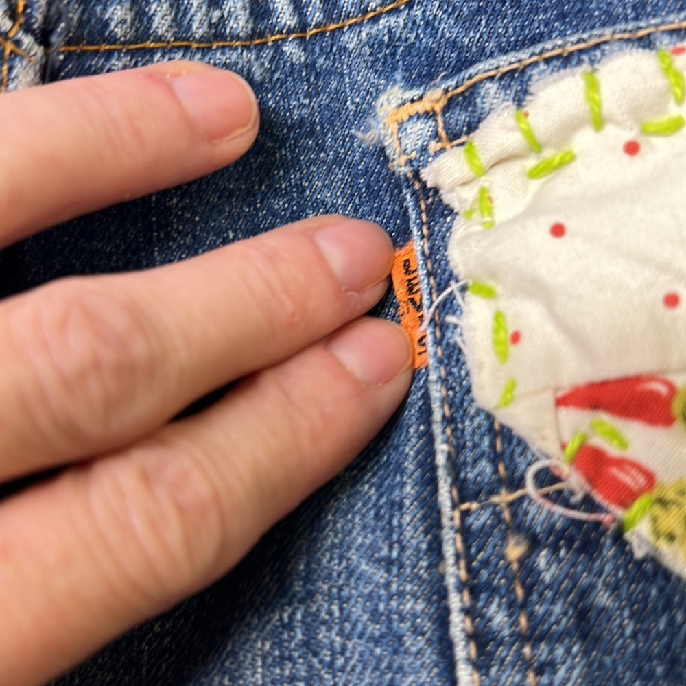 Adorned Crown Textile reworked patch Big E Levi’s cut off shorts upcycle
