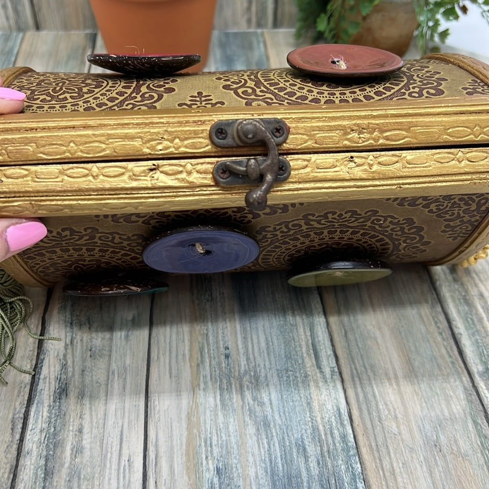 Adorned Crown Altered wood hinged big button gold handle green tassel purse