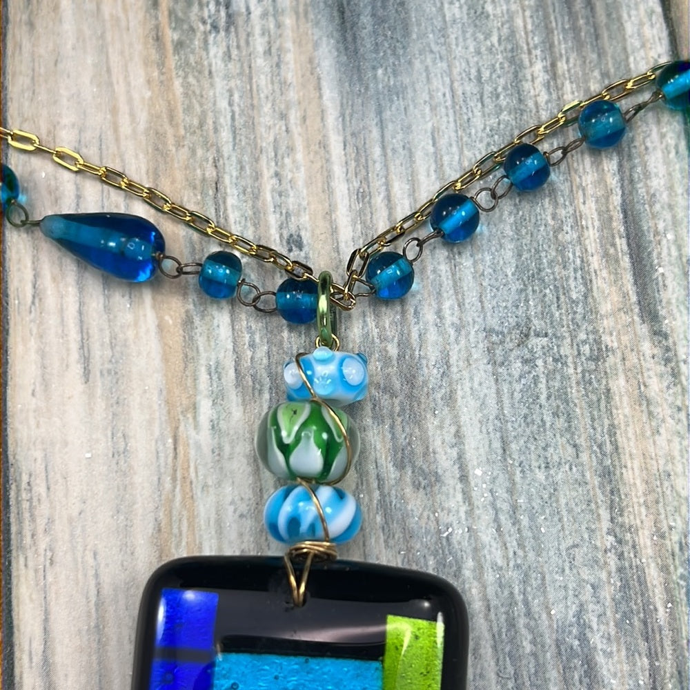 Adorned Crown Artisan Assemblage dichroic glass pendant feather necklace