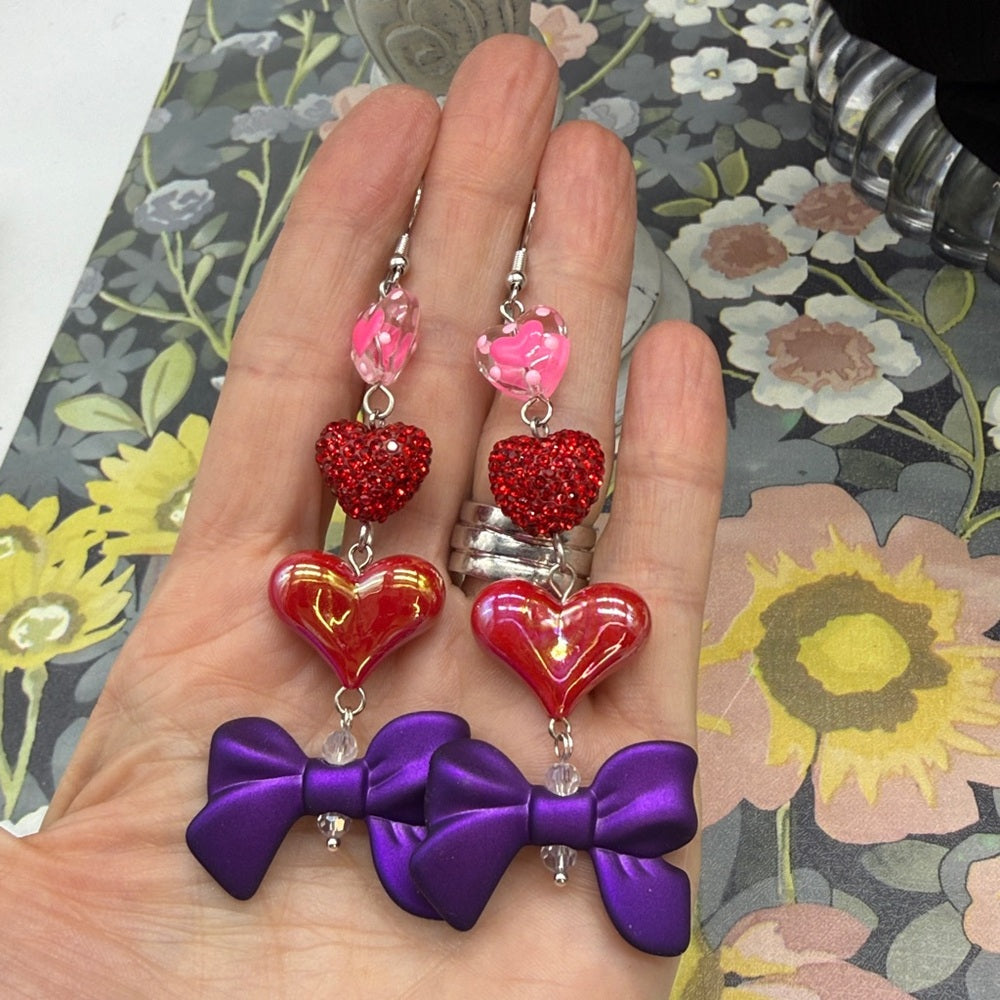 Adorned Crown Jewelry pink heart glitter red bows Valentine's Day earrings