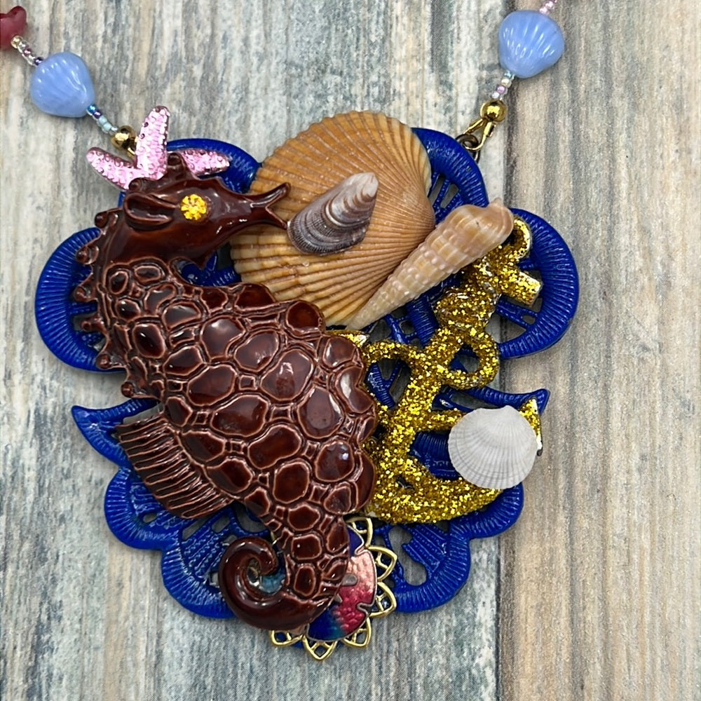Adorned Crown Assemblage beaches & butterflies seahorse collage necklace