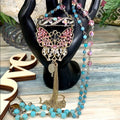 Adorned Crown artisan assemblage pink crystal butterfly necklace