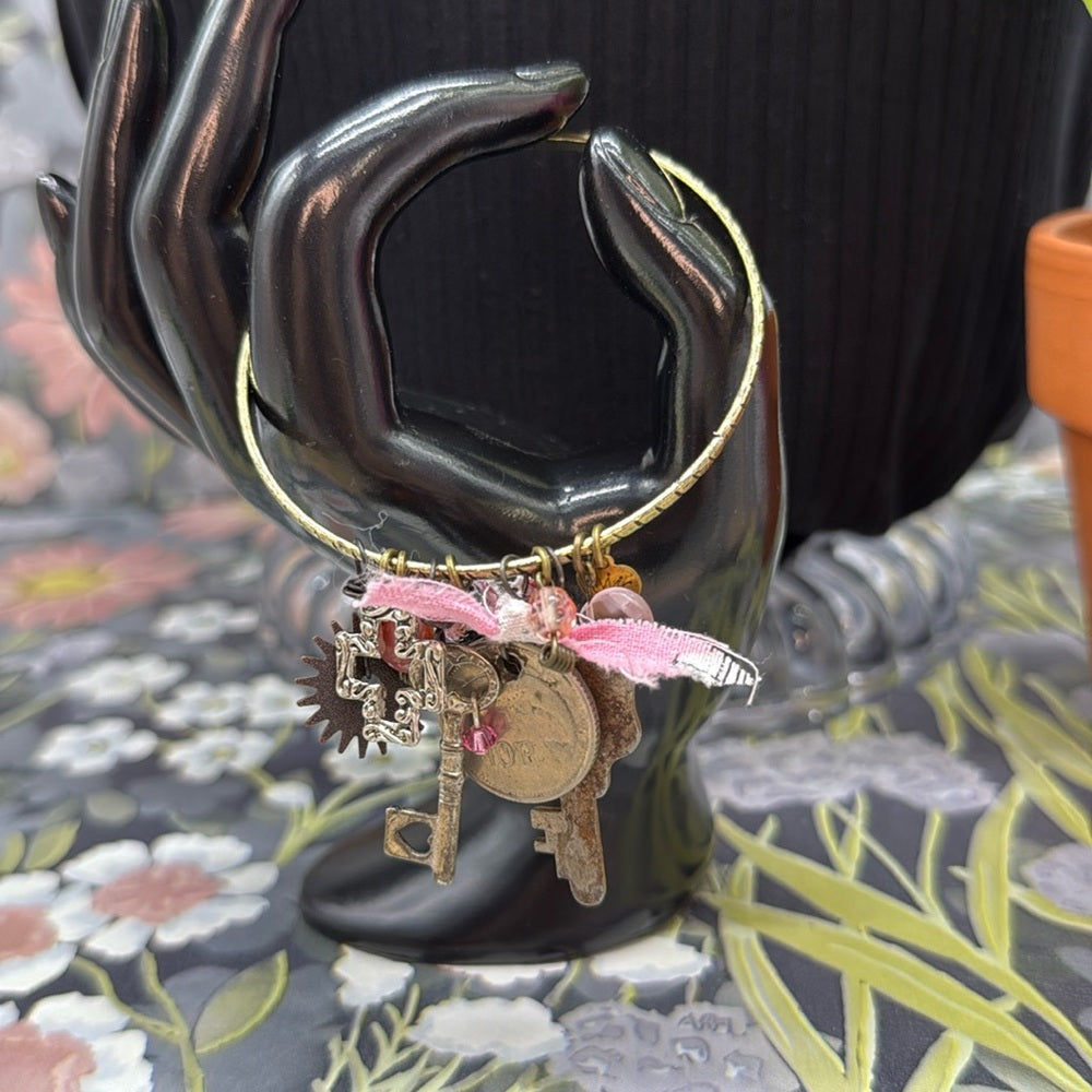 Adorned Crown Jewelry mixed charm key coin pink dangles bangle bracelet