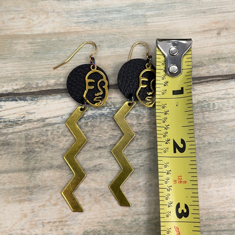 Adorned Crown geometric face zig zag leather earrings