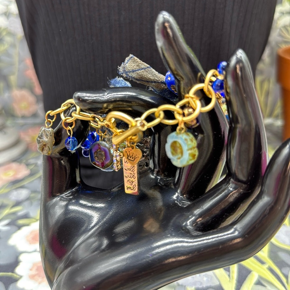 Adorned Crown Jewelry assemblage filigree shades of blue blue charm bracelet