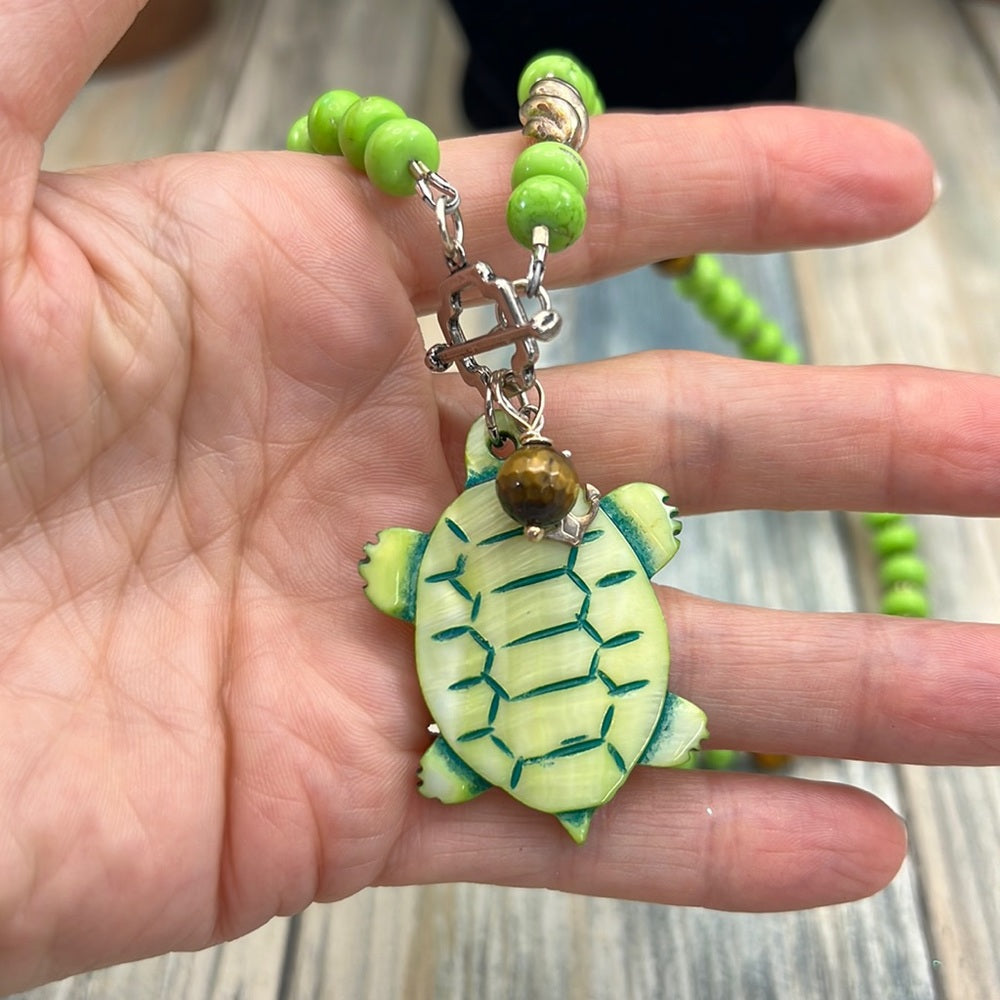 Adorned Crown Assemblage beaches & butterflies turtle anchor necklace
