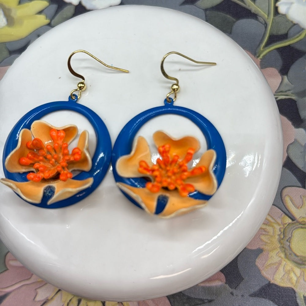 Adorned Crown orange enamel flower on neon teal circle drop earrings