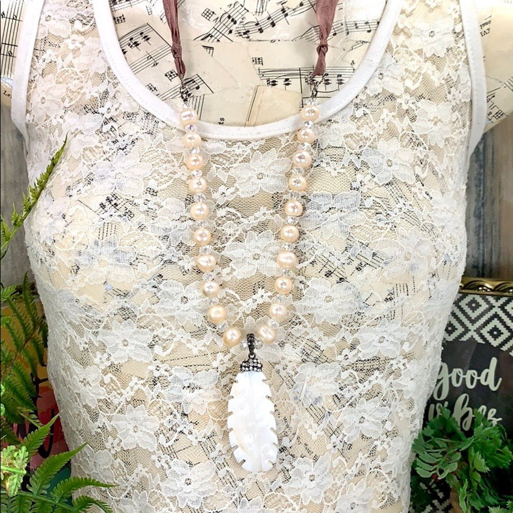 Adorned Crown artisan assemblage carved shell feather pearl silk necklace