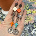 Adorned Crown Jewelry assemblage asymmetrical cross and penny earrings