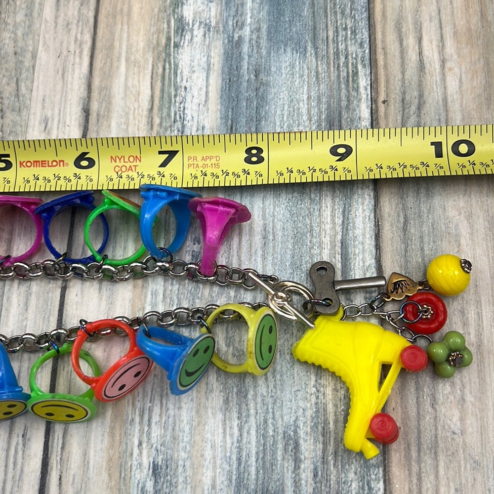 Adorned Crown artisan assemblage child’s roller skate happy face necklace