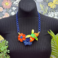 Adorned Crown Jewelry assemblage neon enamel flower blue orange bib necklace