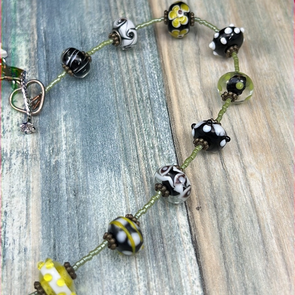 Adorned Crown Artisan Assemblage enamel flower green dot glass bead necklace