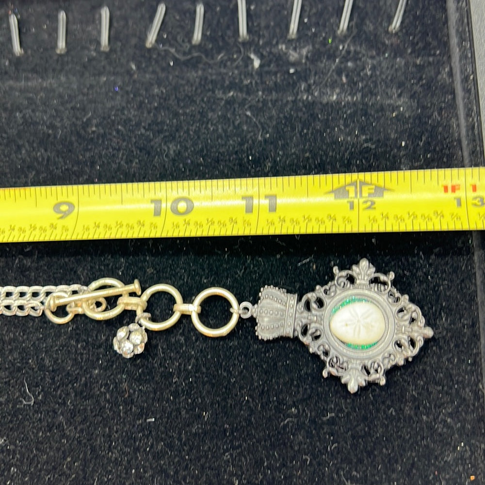 Adorned Crown Assemblage beaches & butterflies sand dollar crown necklace